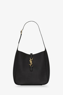 Saint Laurent women’s le à black leather shoulder bag with gold-tone YSL logo clasp and sleek design