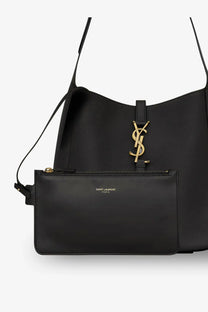 Saint Laurent women’s black leather shoulder bag with gold-tone YSL logo clasp and matching zippered pouch