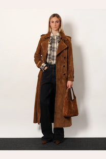 Brown suede trench coat with classic double-breasted design and epaulets shown with saint laurent beige suede shoulder bag