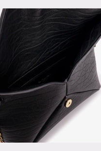 Saint Laurent women’s black leather crossbody bag with textured crocodile-patterned clutch and gold-tone button closure