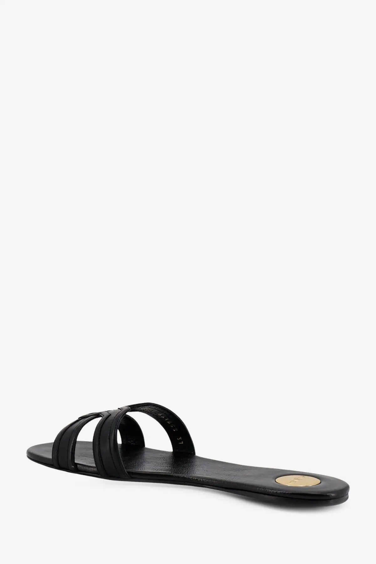 Saint Laurent women’s mabrouka black leather slide sandal with minimalist design and gold circular heel accent