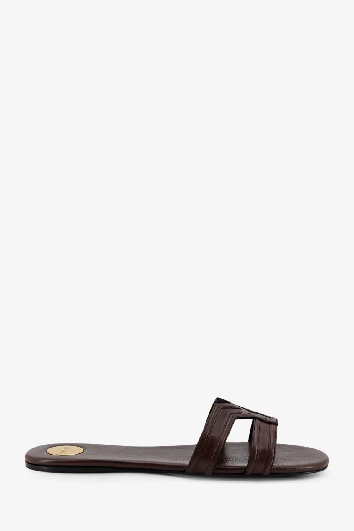 Saint Laurent women’s Mabrouka brown leather slide sandal with minimalist design and small gold logo on the insole