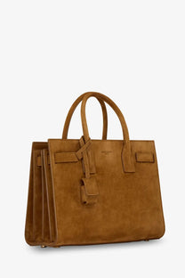Saint Laurent women’s sac de jour baby suede handbag in tan with structured design and top handles