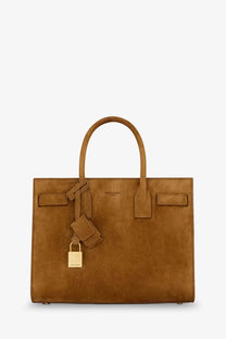 Saint Laurent women’s sac de jour baby tan suede handbag with gold-tone hardware and detachable lock in orange