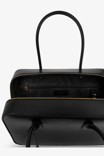 Saint Laurent women’s sac de jour black leather tote bag with gold-tone zippers and handles