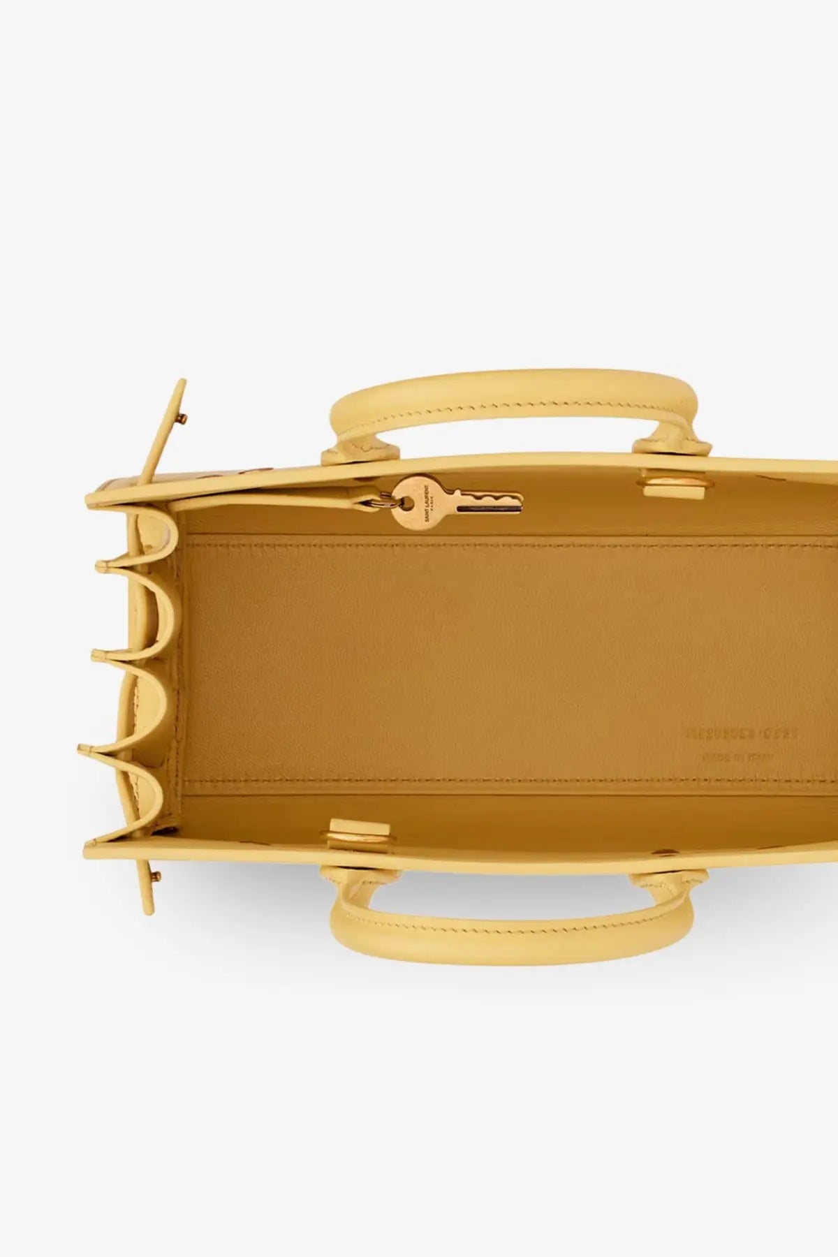 Saint Laurent women’s sac de jour nano leather crossbody bag in yellow with tan scalloped edge and gold-tone key inside