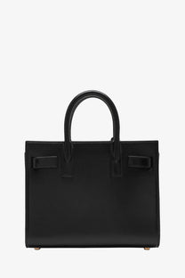 Saint Laurent women’s sac de jour nano black leather bag with structured rectangular shape and top handles