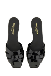 Saint Laurent women’s black patent leather slide sandals with braided design and square toe in Nu Pieds Tribute style