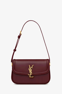 Saint Laurent women’s burgundy leather crossbody bag with gold-tone YSL logo clasp and matching strap