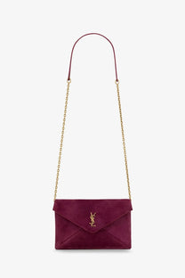 Saint Laurent women’s burgundy velvet envelope clutch with gold-tone YSL logo and matching chain strap crossbody bag