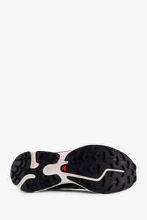 Back view of black and white salomon men’s nylon trail running shoe with red logo on heel for outdoor use