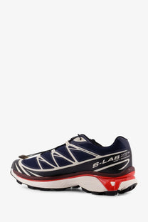 Salomon men’s navy blue and white nylon trail running sneakers with red accents on the midsole