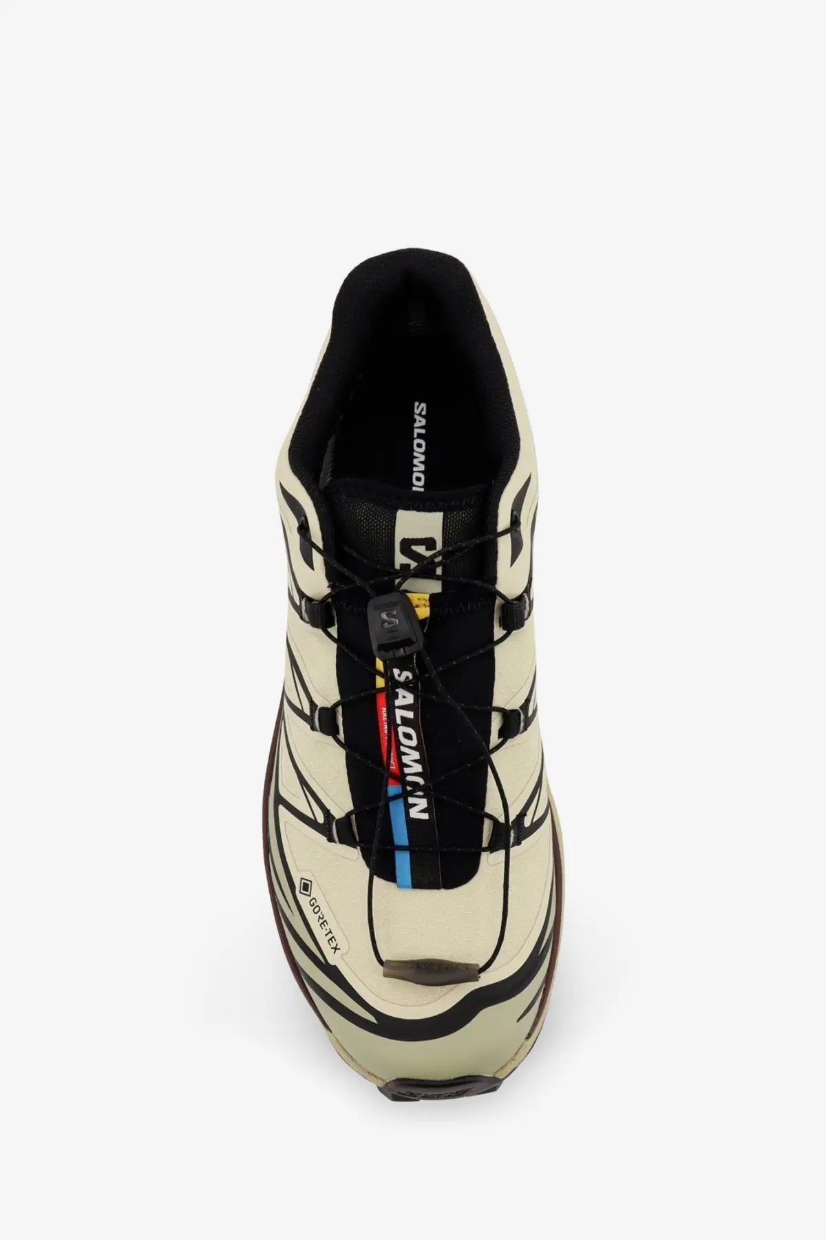 Salomon men’s technical fabric sneakers in cream with black accents feature a rugged breathable design for trail running