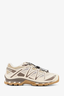 Salomon men’s xt quest low top sneakers in beige and brown with mesh upper rubber outsole and lacing system
