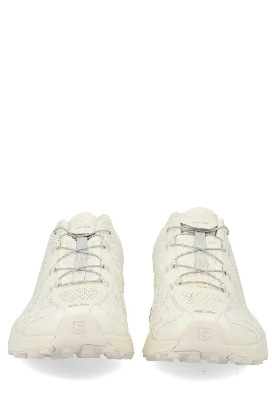 A pair of off-white salomon unisex sneaker xt whisper trail running shoes with textured upper and gray laces