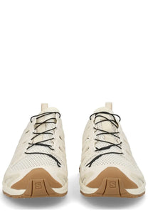 Cream-colored Salomon unisex XA Pro 3D Amphib running shoes with black laces and tan rubber soles for outdoor use