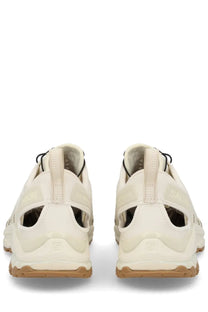 Cream-colored salomon unisex xa pro 3d amphib sneaker with black laces and textured rubber outsole for trail running