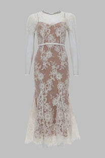 A delicate ivory lace mermaid dress with floral embroidery and matching belt from self-portrait white collection