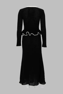 Black knitted midi dress by self-portrait with white pearl embellishments on neckline waistband and hem