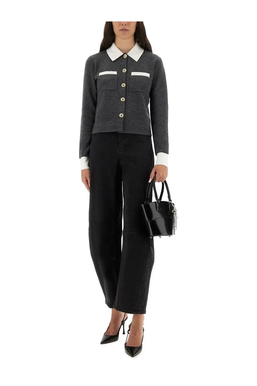 Black patent leather bucket bag with silver chain detailing paired with self-portrait women’s barrel leg jeans black