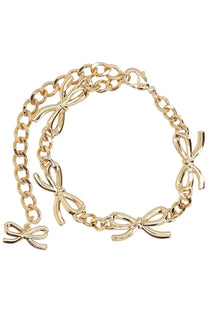 Gold-toned crystal bow bracelet by self-portrait featuring three-dimensional bow charms on a chain design