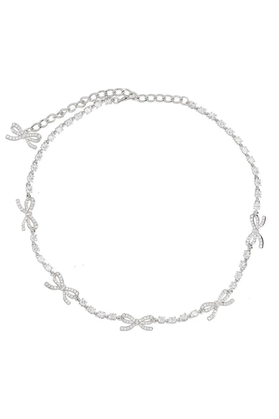 Delicate silver chain necklace with sparkling diamond-encrusted crystal bow charms from self-portrait women’s collection