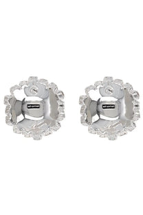 Silver flower-shaped stud earrings with faceted crystal border and central self-portrait brand tag