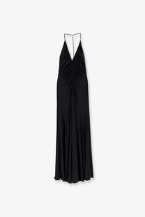 Black satin halter gown by self-portrait with deep v-neckline and ruched bodice in gathered jersey long dress style