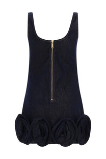 Back view of self-portrait women’s blue velvet mini dress with gold zipper and large ruffled rose appliqués hem
