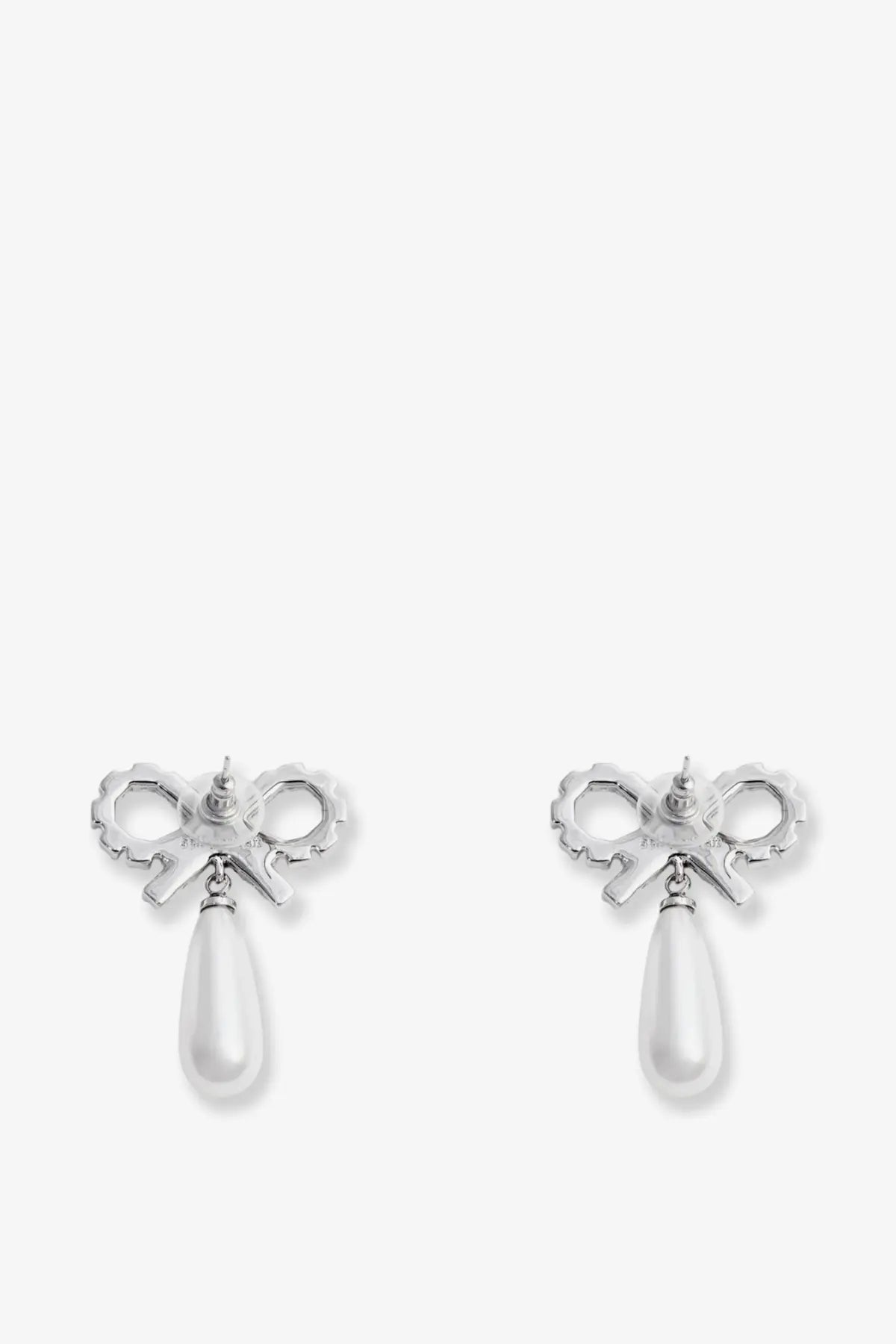 Silver brass bow-shaped earrings for women with white pearl drops from Self-Portrait