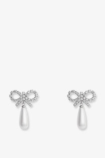 Delicate self portrait women’s silver brass earrings with silver bow, sparkling crystals, and dangling white teardrop pearls