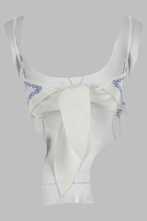White satin crop top with delicate blue embroidery and central bow from self-portrait lino con ricamo white collection