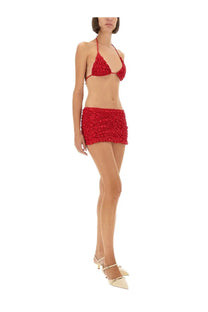 Selia Richwood women’s red textured crochet bikini top and matching mini skirt set in a vibrant red color