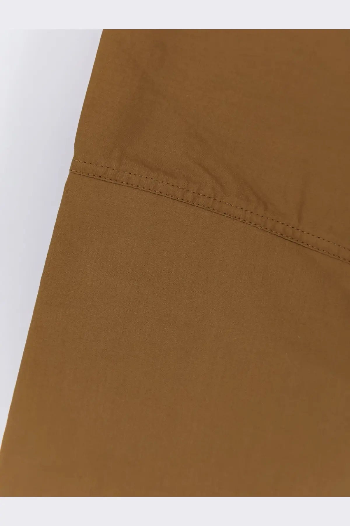 Tan-colored cotton fabric with neat matching stitching along the seam on soeur women’s armand cotton shirt beige