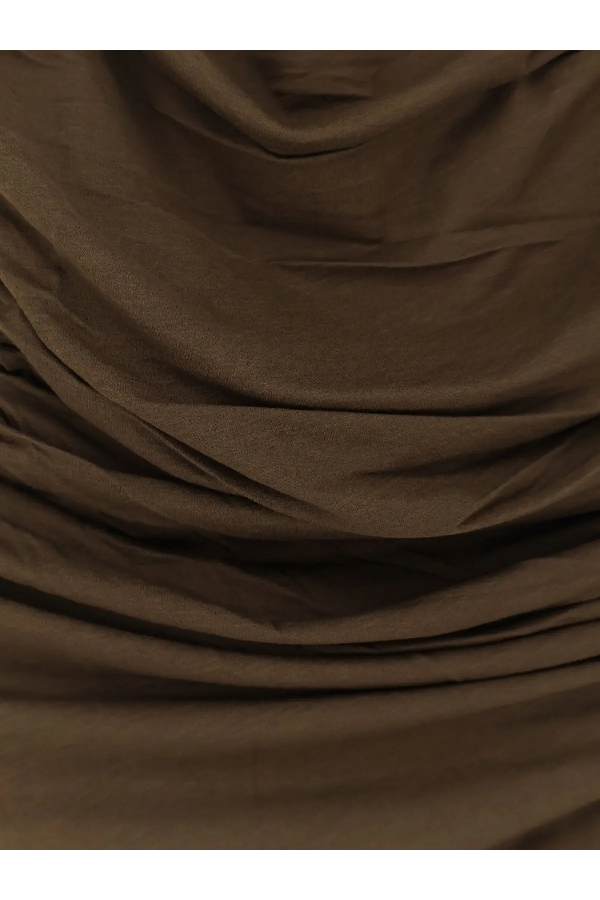 Soeur women’s cotton blend irina top green shown with soft draped brown fabric highlighting gentle folds and subtle sheen