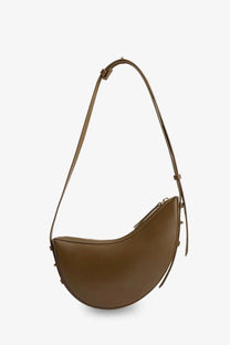 Soeur women’s Wino mini caramel-brown leather crescent crossbody bag with adjustable strap and metallic hardware accents