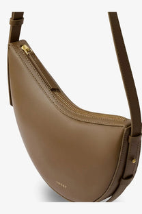 Soeur women’s wino mini crossbody bag in tan leather with curved design and gold-tone zipper in bronze finish