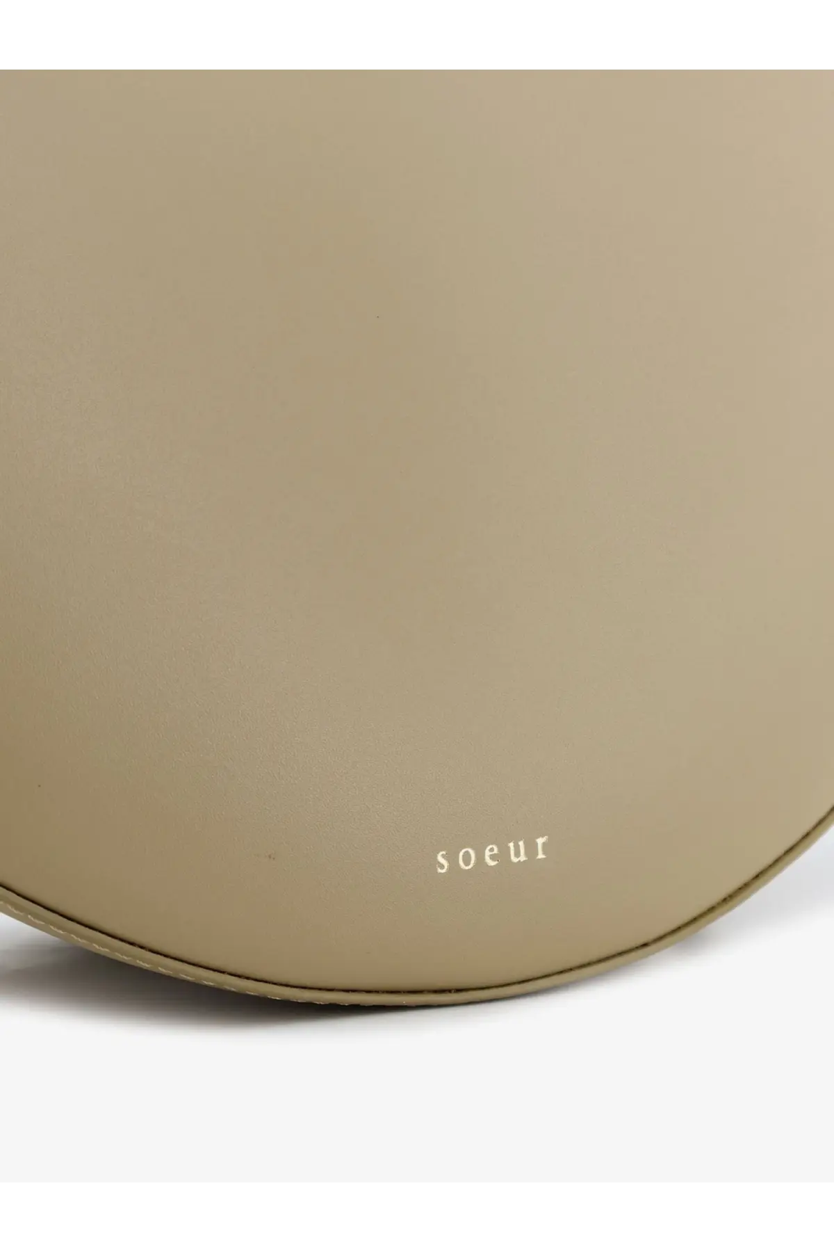 Beige leather round handbag with subtle soeur branding featured in soeur women’s winona leather crossbody bag beige