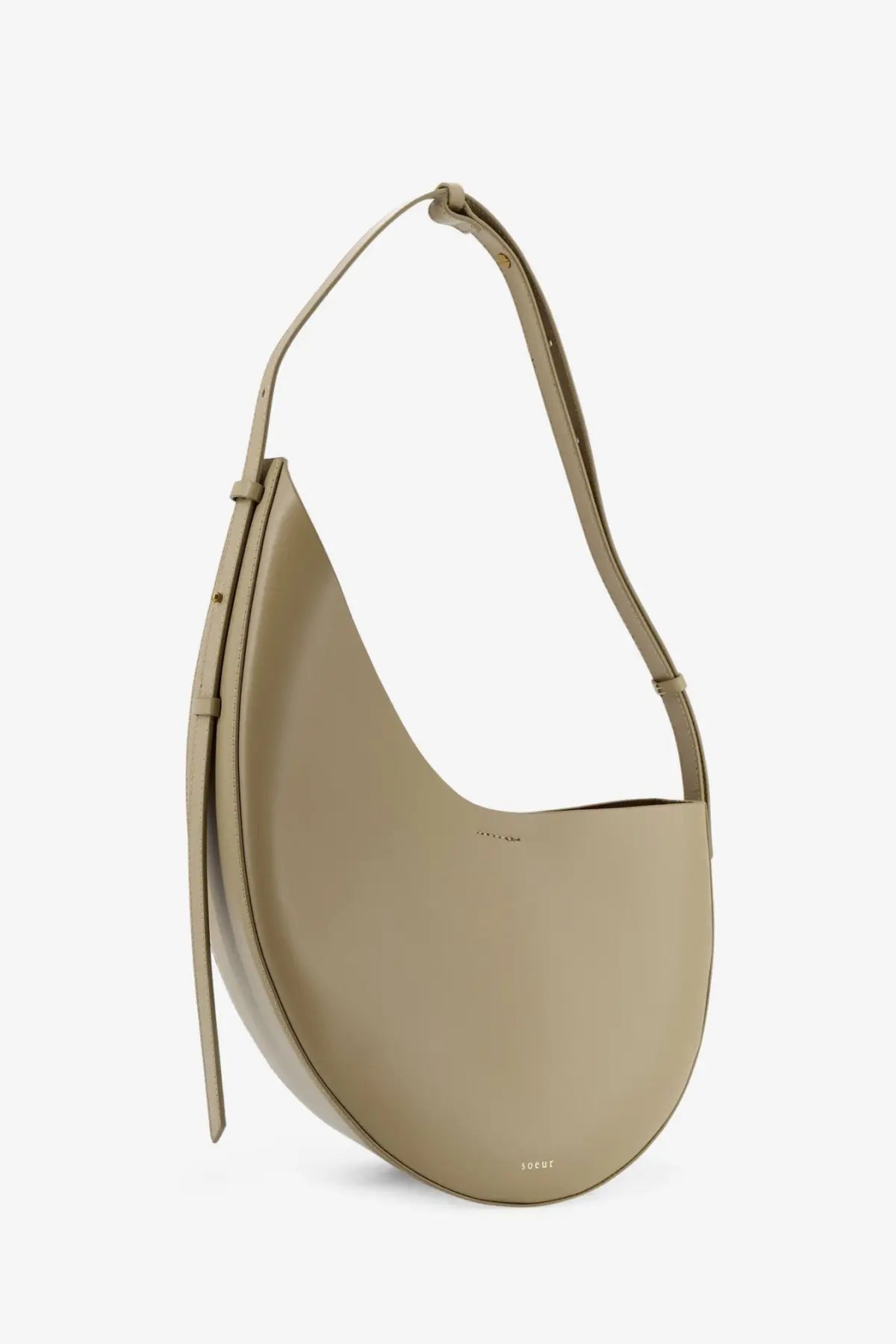 Soeur women’s Winona beige leather crossbody bag with sleek minimalist design curved silhouette and adjustable strap