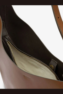 Soeur women’s Winona leather crossbody bag in brown with gold-toned zipper and light beige interior lining