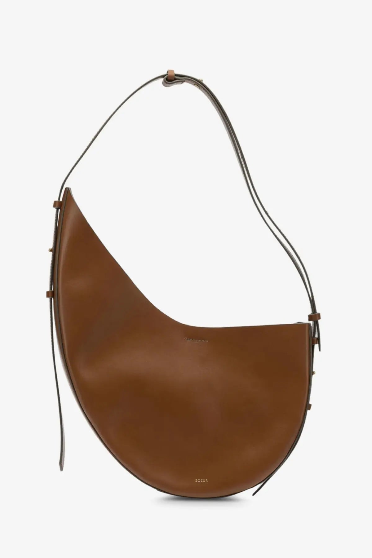 Soeur women’s Winona leather crossbody bag in caramel brown leather with curved silhouette and dark brown straps