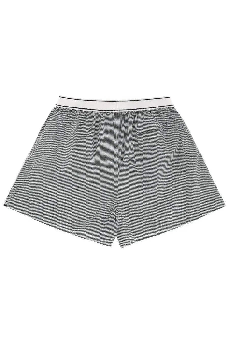 Gray and white vertically striped boxer shorts with a clean minimalist design from sporty and rich unisex striped shorts green