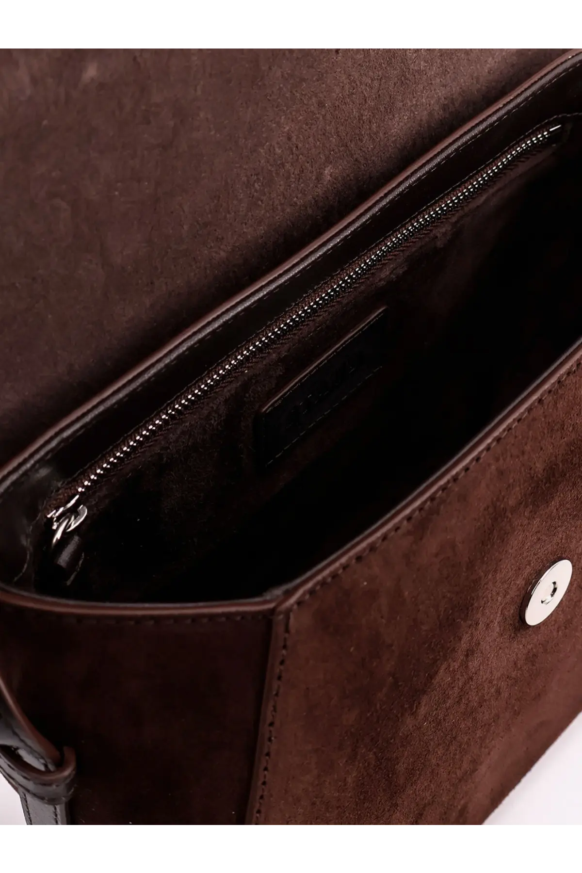 Staud women’s bella saddle suede crossbody bag in brown with silver-toned button closure and zipper lining