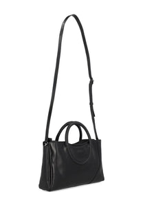 Black leather Staud women’s Maude mini satchel bag with long shoulder strap and two top handles