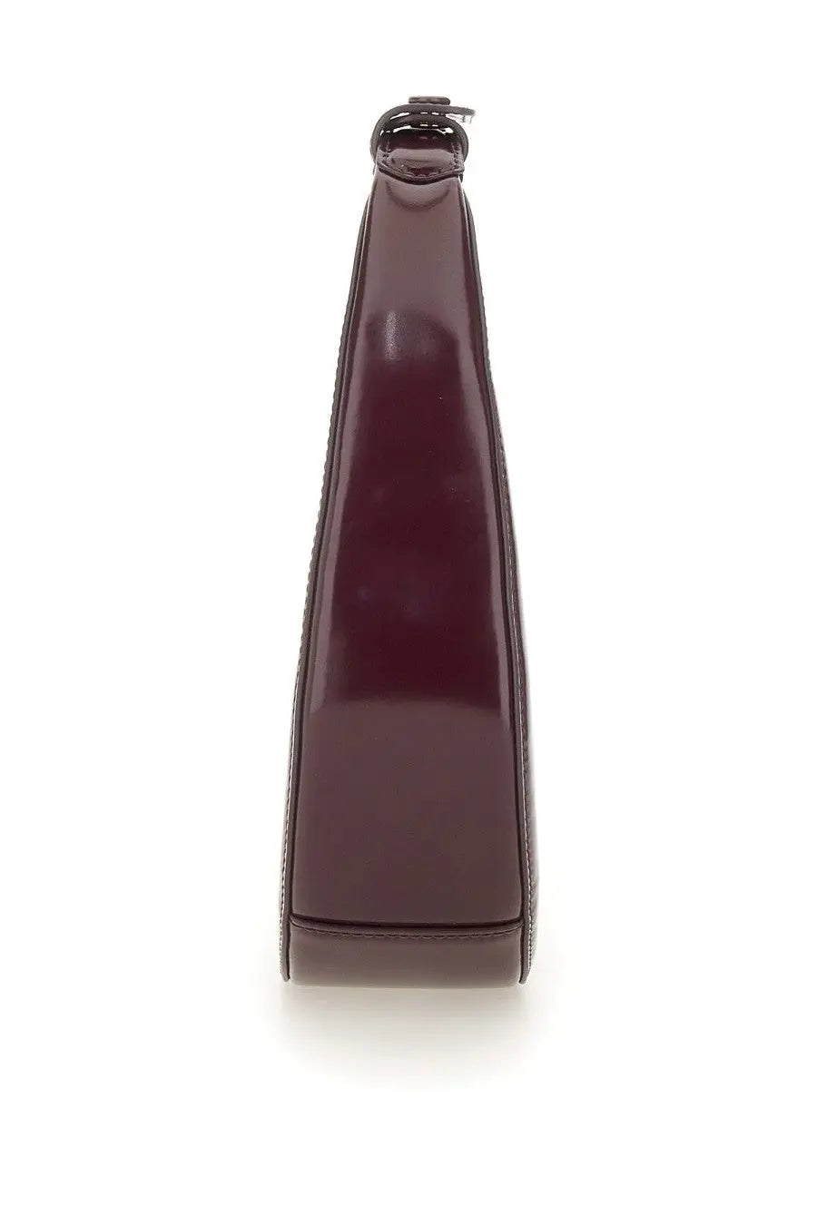 A sleek glossy burgundy leather mini moon bag with minimalist design and top handle by Staud women’s collection