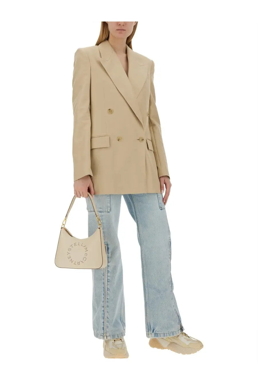 Beige leather handbag with gold-tone hardware and circular logo embossed on front for stella mccartney jacket accessory