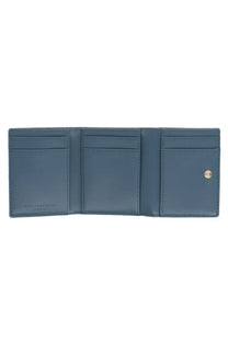 A sleek navy blue leather trifold wallet with precise stitching and gold snap closure from Stella McCartney