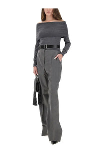 Gray off-the-shoulder knit top with long sleeves and black belt paired with stella mccartney women’s grey flannel pants