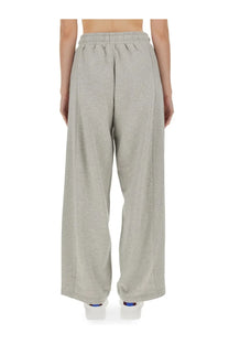 Light gray Stella McCartney women’s jogging pants with wide-leg cut elastic waistband and subtle side seams