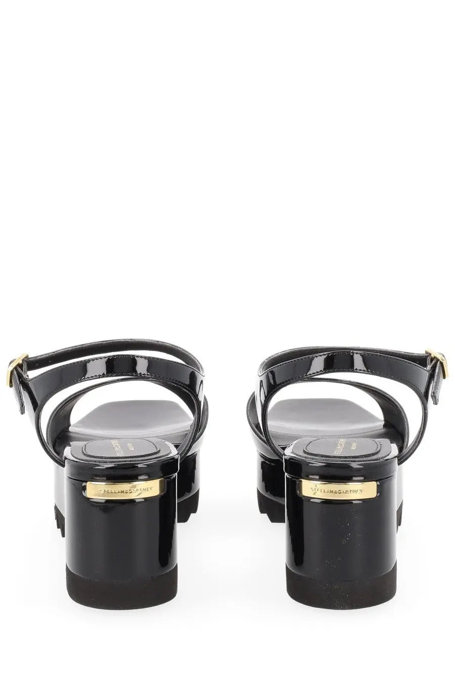 Black patent leather platform sandals by stella mccartney with gold-tone branding on the heel back view